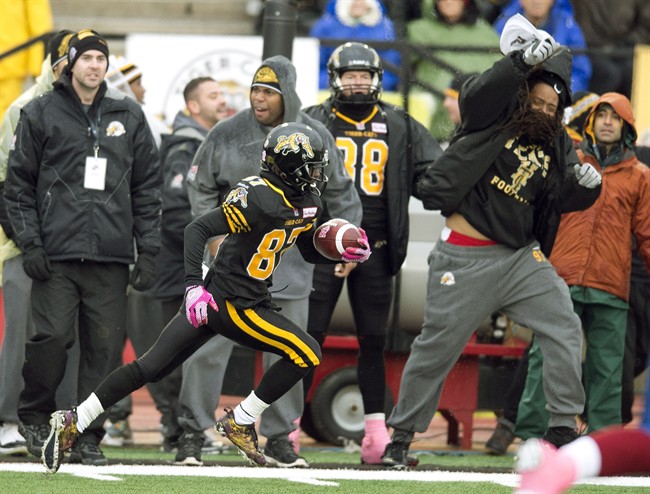 Hamilton Tiger-Cats kick returner Brandon Banks runs up-field on his touchdown return against the Montreal Alouettes in Guelph on Oct. 26, 2013.