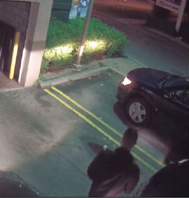 Police surveillance of Ford and Lisi with packages at a Scarlett Road gas station - image