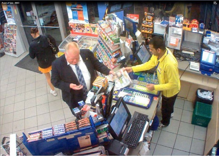Police surveillance of Ford and Lisi with packages at a Scarlett Road gas station - image