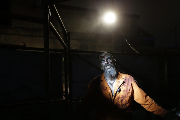In this Friday, Sept. 27, 2013 photo, a zombie inmate poses for a portrait during the Halloween haunted house Terror Behind the Walls, at Eastern State Penitentiary in Philadelphia. 