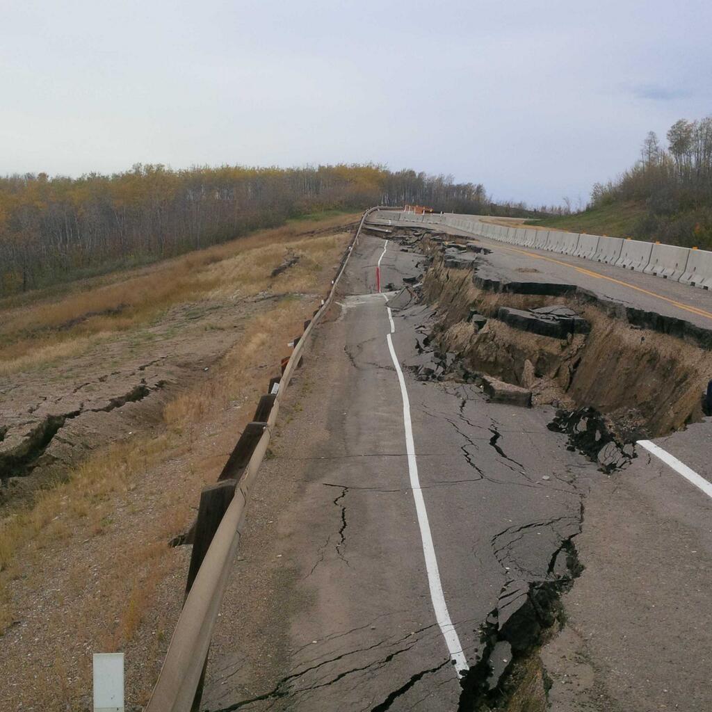 Alberta Transportation Minister Ric McIver shows the state of Highway 989 near Peace River.