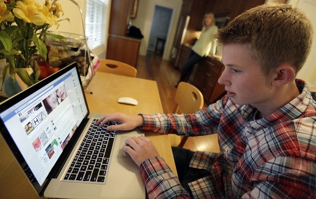 A 16-year-old boy uses the Internet in this file photo.