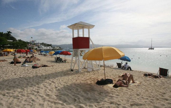 This picture taken on 10 March 2007, shows tourists sunbathing at Doctor Cave beach in Montego Bay, Jamaica.