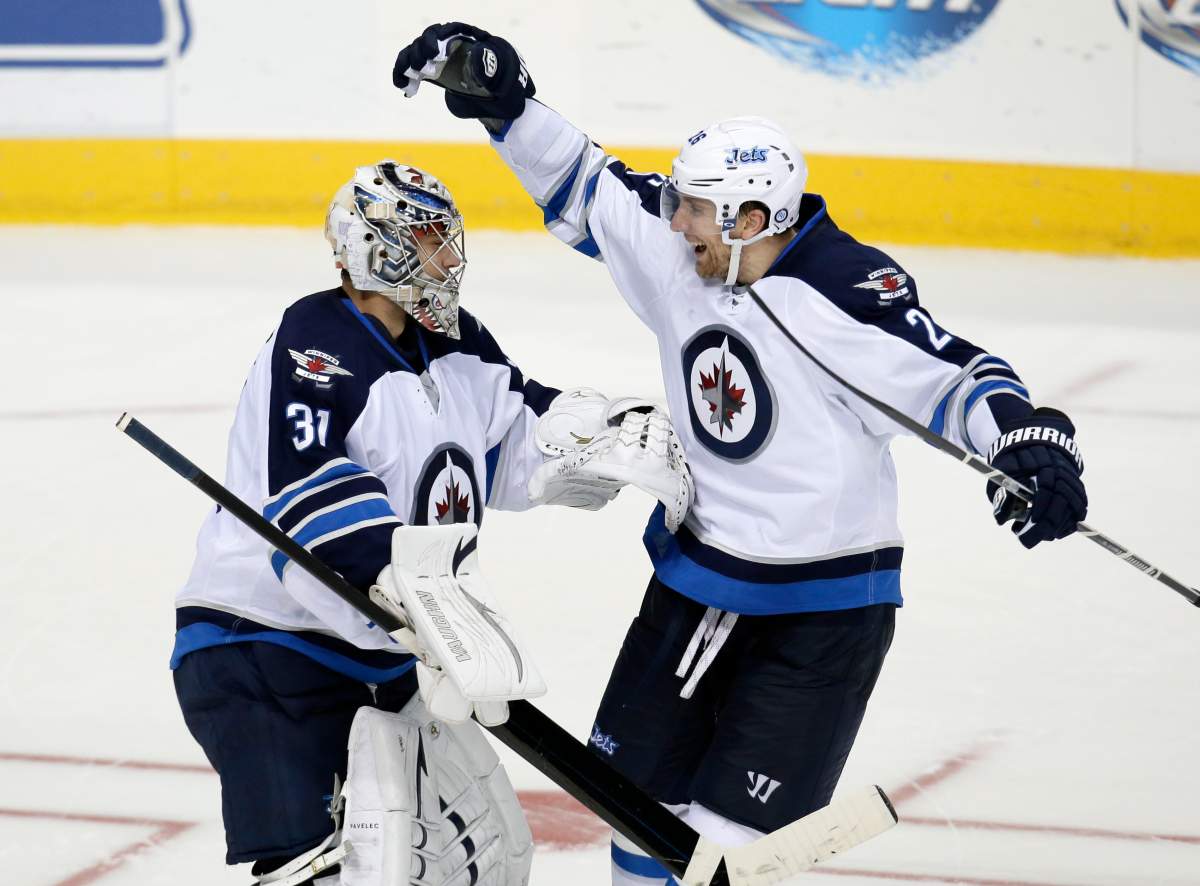 Winnipeg Jets goalie Ondrej Pavelec and forward Michael Frolik will suit up for the Czech Republic in next month's Winter Olympics.