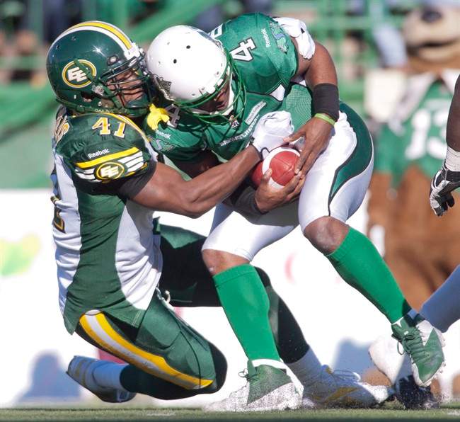 Saskatchewan Roughriders quarterback Darian Durant is sacked Edmonton Eskimos defensive end Odell Willis during the first quarter of CFL football action in Regina, Sask., Saturday, October 12, 2013.