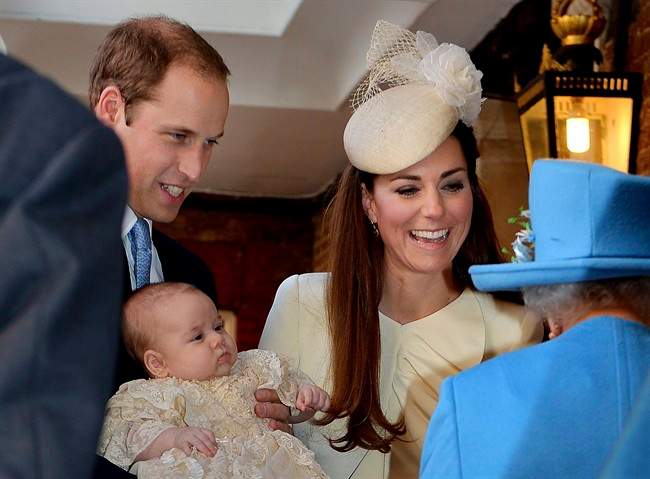 Britain\’s Queen Elizabeth II, right, speaks with Prince William and Kate Duchess of Cambridge as they arrive with their son Prince George at the Chapel Royal in St James\’s Palace, Wednesday Oct. 23, 2013.