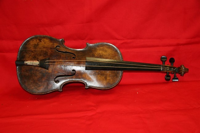 This is an undated handout image from auction house Henry Aldridge and Son made available on Friday Oct. 18, 2013 shows a violin believed to be the one played by Titanic bandmaster Wallace Hartley will now go on auction. I.