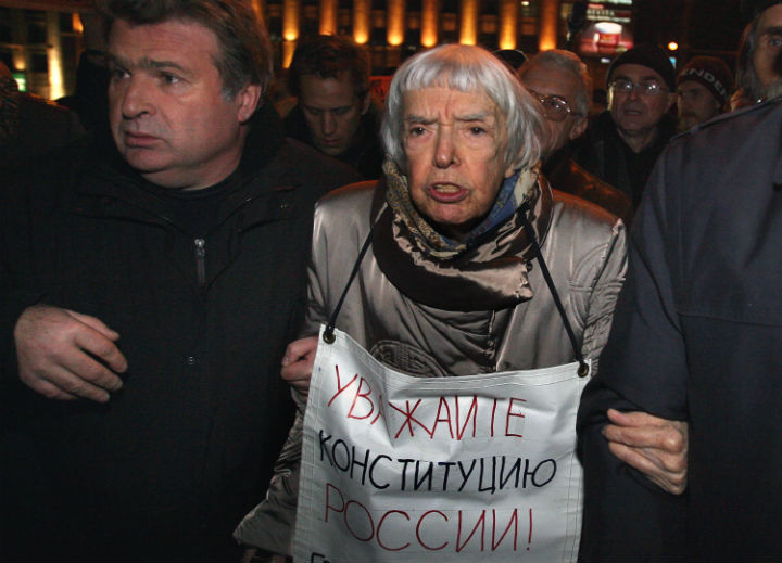 Russian human rights activist Lyudmila Alexeyeva holds a poster reading ‘Respect the Constitution!’ in central Moscow on October 31, 2009. (Photo: Alexey Sazonov/AFP/Getty Images)
