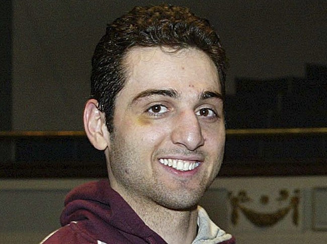  In this Feb. 17, 2010, file photo, Tamerlan Tsarnaev smiles after accepting the trophy for winning the 2010 New England Golden Gloves Championship in Lowell, Mass.
