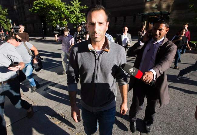 Toronto Mayor Rob Ford's occasional driver Alexander Lisi leaves court after being granted bail on drug charges in Toronto, Wednesday October 2, 2013. 