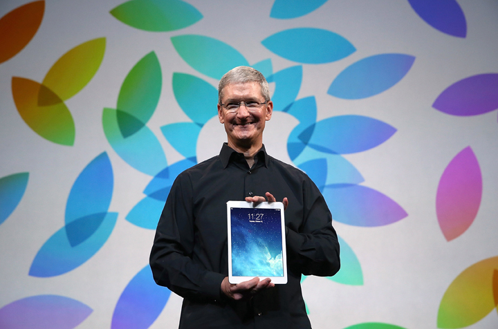 Apple CEO Tim Cook holds the new iPad Air during an Apple announcement at the Yerba Buena Center for the Arts on October 22, 2013 in San Francisco, California. 