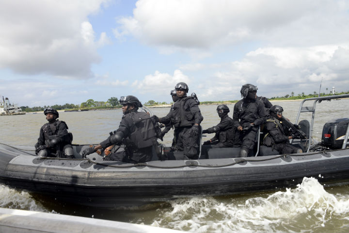 Nigerian navy special forces patrol the waters during a joint military exercise between Nigerian armed forces, United States, Britain, Netherlands and Spain in Lagos in October 18, 2013. The exercise was designed to improve the capacity of Nigeria's armed forces in its war against oil theft and other criminal activities in the creeks and high seas.