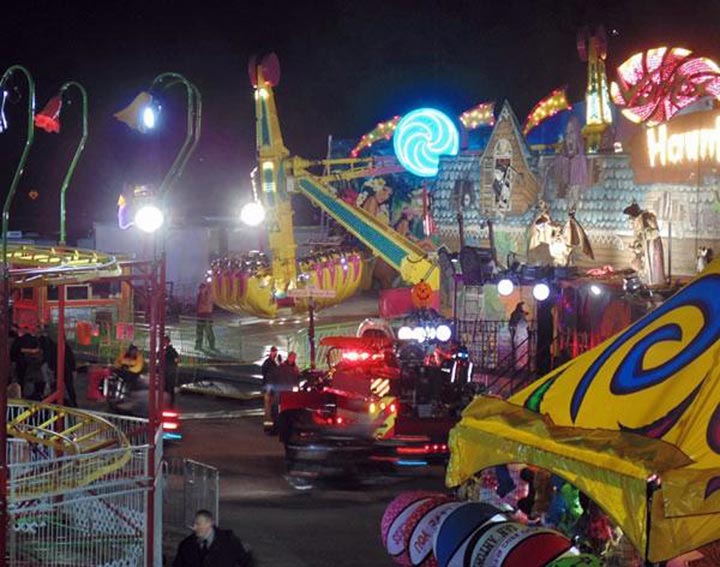 In this photo provided by WNCN, emergency crews respond to the scene where a ride malfunctioned at the North Carolina State Fair, Thursday, Oct. 24, 2013 in Raleigh, N.C. 