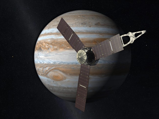 This illustration depicts NASA's Juno spacecraft with Jupiter in the background. NASA's Jupiter-bound spacecraft will swing by Earth for one last visit Wednesday Oct. 9, 2013, before speeding to the outer solar system. 