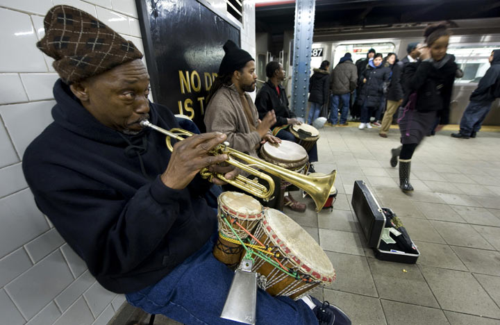 A group of musicians perform at the Number 4, 5, 6 subway station in Harlem February 4, 2009 in New York. (Photo credit: DON EMMERT/AFP/Getty Images)