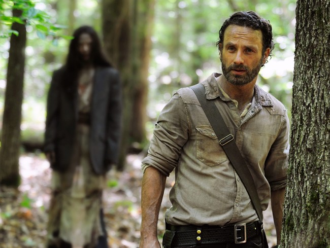 This image released by AMC shows Andrew Lincoln as Rick Grimes in a scene from the season four premiere of "The Walking Dead,"