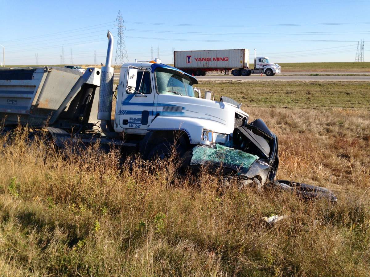A gravel truck and car crashed on the Perimeter Highway at Gunn Road in Winnipeg on Friday.