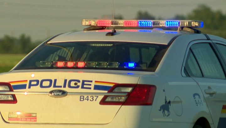 An woman is dead after she was hit by a passing vehicle while attempting to flag down help after a crash in central Alberta.