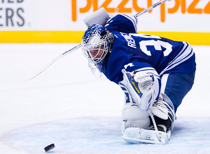 Toronto Maple Leafs goalie James Reimer makes a save against the Pittsburgh Penguins during first period NHL hockey action in Toronto on Saturday, Oct. 26, 2013. THE CANADIAN PRESS/Nathan Denette.