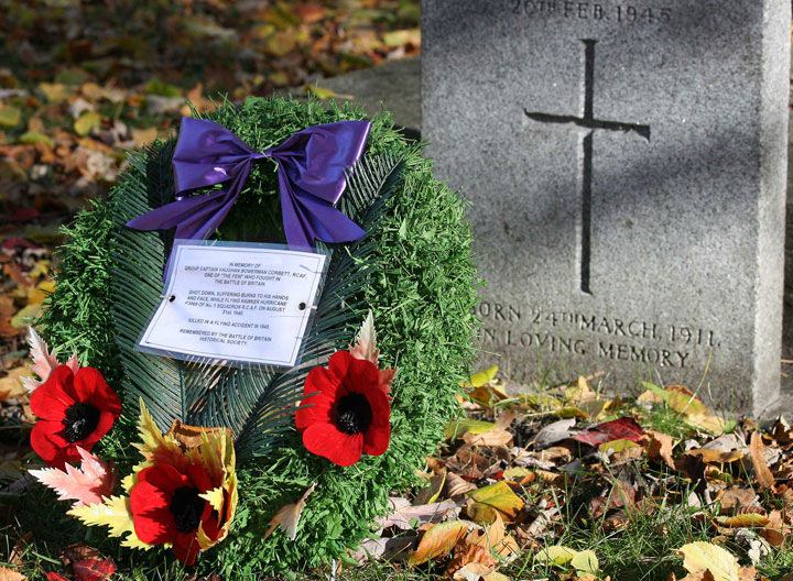 A wreath of poppies sits in front of the headstone of Capt. Vaughan Bowerman Corbett, who was shot down while fighting in the Battle of Britain in 1940, in St. James Cemetery on Parliament St.