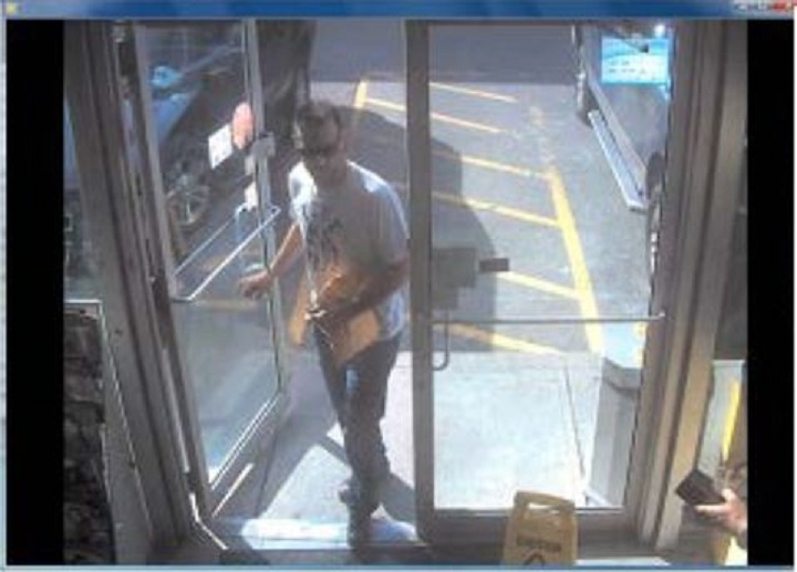 Police surveillance of Ford and Lisi with packages at a Scarlett Road gas station - image