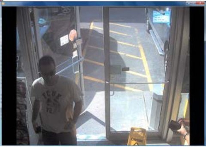 Police surveillance of Ford and Lisi with packages at a Scarlett Road gas station - image