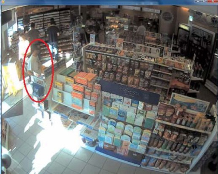 Police surveillance of Ford and Lisi with packages at a Scarlett Road gas station - image