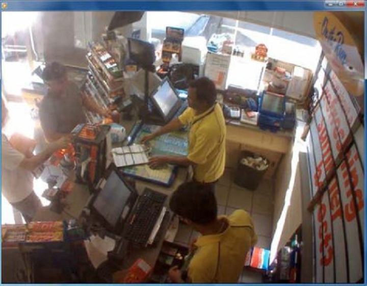 Police surveillance of Ford and Lisi with packages at a Scarlett Road gas station - image