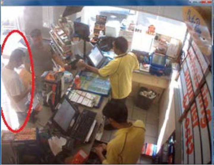 Police surveillance of Ford and Lisi with packages at a Scarlett Road gas station - image