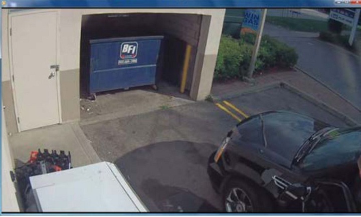 Police surveillance of Ford and Lisi with packages at a Scarlett Road gas station - image