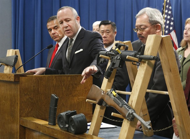 In this Feb. 7, 2013 file photo, Senate President Pro Tem Darrell Steinberg, second from left, gestures to a pair of semi-automatic rifles as he discusses a package of proposed gun control legislation at a Capitol news conference in Sacramento, Calif. Gov. Jerry Brown vetoed Steinbergs's SB374 which would have banned future sales of most semi-automatic rifles that accept detachable magazines, Friday, Oct. 11, 2013.(AP Photo/Rich Pedroncelli,File).