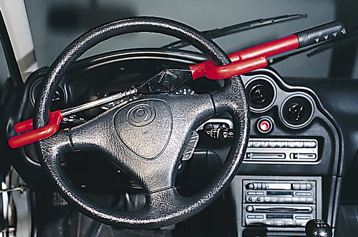 The Club, an often-seen consumer good used in order to deter would-be thieves from stealing a car taken in  Toronto, ON in August, 1998. 