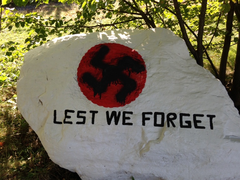 A swastika was painted over Eunice Parsons’ art depicting a poppy and the words “Lest We Forget”. (Photo: Julia Wong/Global News)