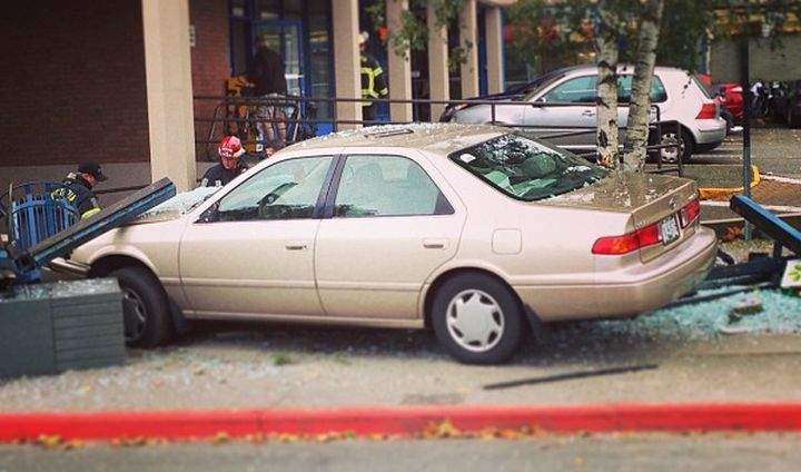 Two pedestrians were injured after a car crashed into a bus stop in Victoria Monday afternoon. 