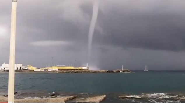 This file photo shows a waterspout over a lake.