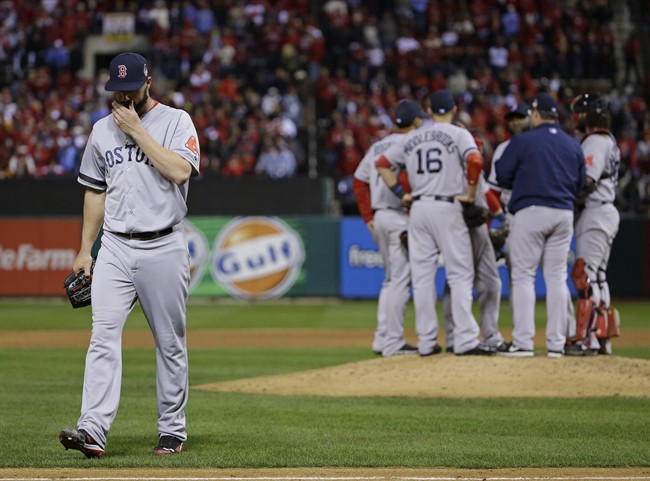 Boston Red Sox relief pitcher Brandon Workman walks off after being taken out of the game during the ninth inning of Game 3 of baseball's World Series against the St. Louis Cardinals Saturday, Oct. 26, 2013, in St. Louis. (AP Photo/Matt Slocum).