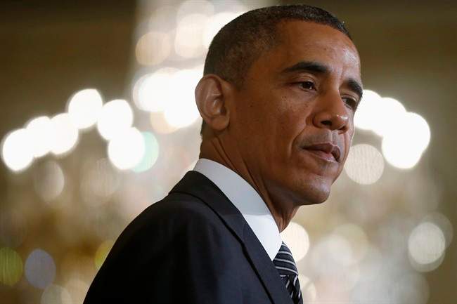 FILE - This Oct. 24, 2013 file photo shows President Barack Obama in the East Room of the White House in Washington. 