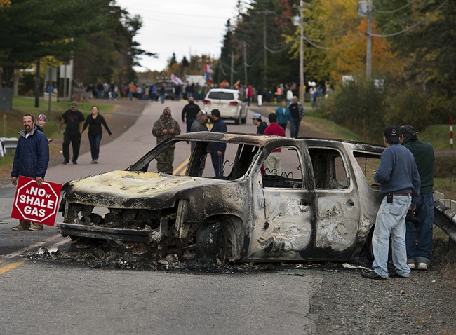 A police vehicle is seen in Rexton, N.B. as police began enforcing an injunction to end an ongoing demonstration against shale gas exploration in eastern New Brunswick on Oct.17, 2013.