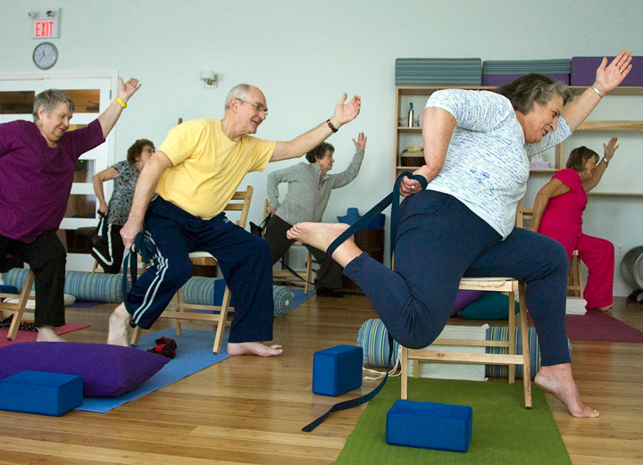 Seniors participate in a yoga class on Friday, Dec. 31, 2010. Members of the group say practicing gentle yoga has improved both their physical and mental health as they grow older. 