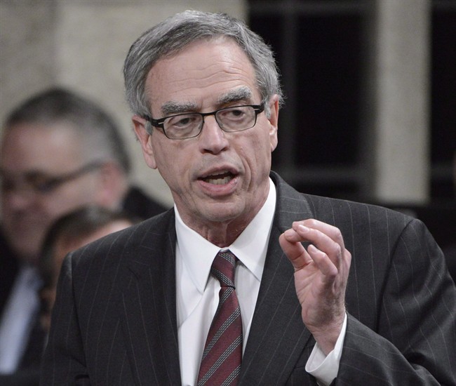 Natural Resources Minister Joe Oliver rises during Question Period in the House of Commons in Ottawa, Wednesday, April 17, 2013.