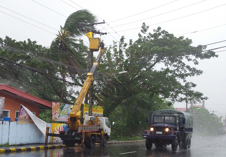 Soldiers make the rounds to enforce the evacuation of residents as powerful typhoon Haiyan hits Legazpi city, Albay province. (AP Photo/Nelson Salting)