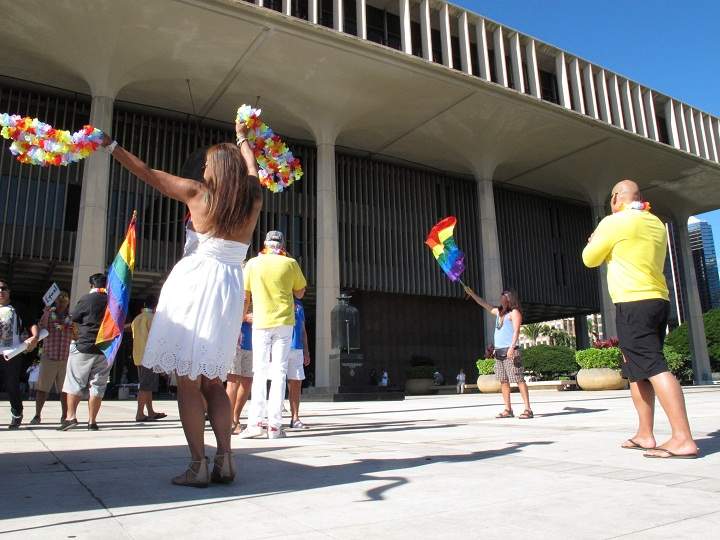 Gay marriage supporters rally outside the Hawaii Capitol in Honolulu ahead of a Senate vote on whether to legalize same-sex marriage on Tuesday, Nov. 12, 2013. 