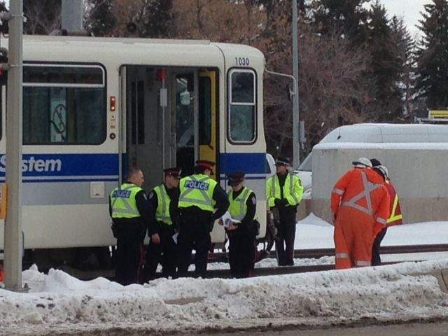 Police investigate a collision between a pedestrian and an LRT train on November 25, 2013.