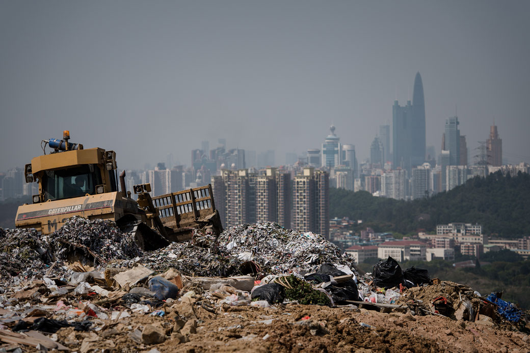 A landfill in the new territories of Hong Kong as the Chinese city of Shenzhen looms in the background. Official data shows that the city generates about 19,000 tonnes of solid waste every day, with 9,100 tonnes dumped into landfills -- two thirds of it domestic waste. 