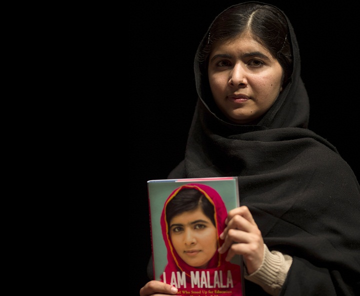 Malala Yousafzai holds her memoir, 'I Am Malala' during a photocall at the South Bank centre on October 20, 2013 in London, England. The 16-year-old was shot by the Taliban for championing girls' rights to an education in the Swat Region in Pakistan in 2012. 