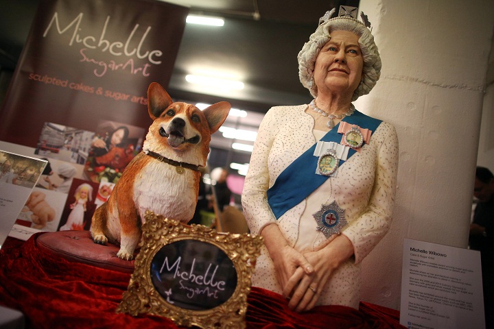 A cake depicting Queen Elizabeth II and a corgi dog made by cake and sugar artist Muchelle Wibowo. (Peter Macdiarmid/Getty Images)