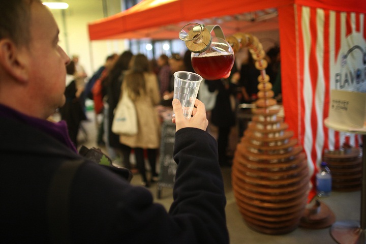 A visitor to the Experimental Food Society Exhibition takes a drink from a self serving interactive sculpture called a ‘Tropism Well’. (Peter Macdiarmid/Getty Images)
