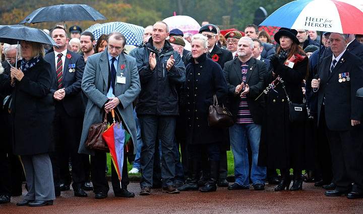 Mourners gather on Armistice Day for the funeral service of World War 2 veteran Harold Percival in Lytham, north-west England, on November 11, 2013. Requests appeared in local media for people to attend the funeral of Harold Percival, who died at the age of 99, had no close family members, never married or had any children. 