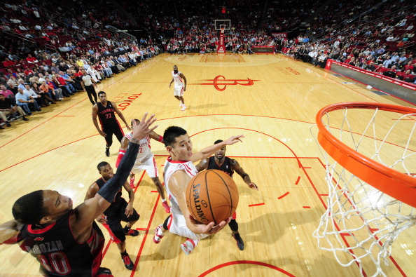 Jeremy Lin #7 of the Houston Rockets glides to the basket against the Toronto Raptors on November 11, 2013 at the Toyota Center in Houston, Texas.