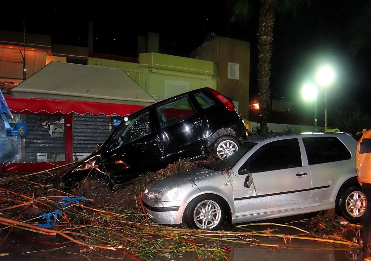 Cars damaged after heavy rainfall on the island of Rhodes on November 23, 2013.